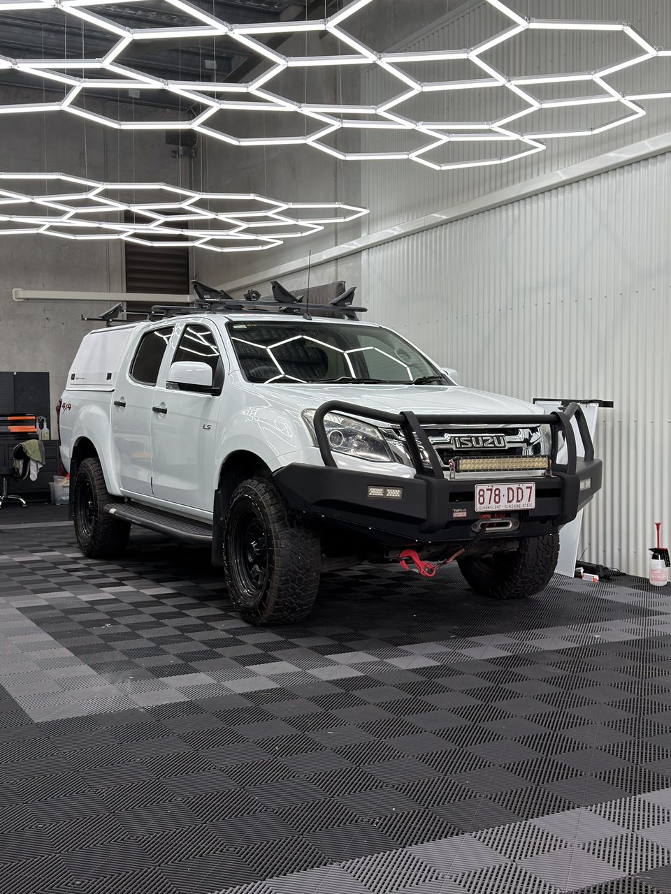 A white Isuzu D-MAX in the Posh Wash shop after its ceramic coating